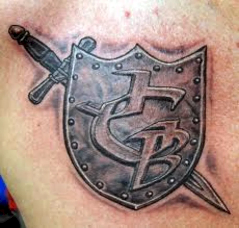 Crossed Hammers Shield Tattoo