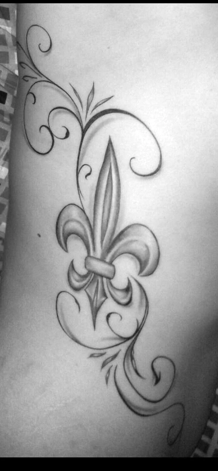 Fleur de Lis Sword Tattoo