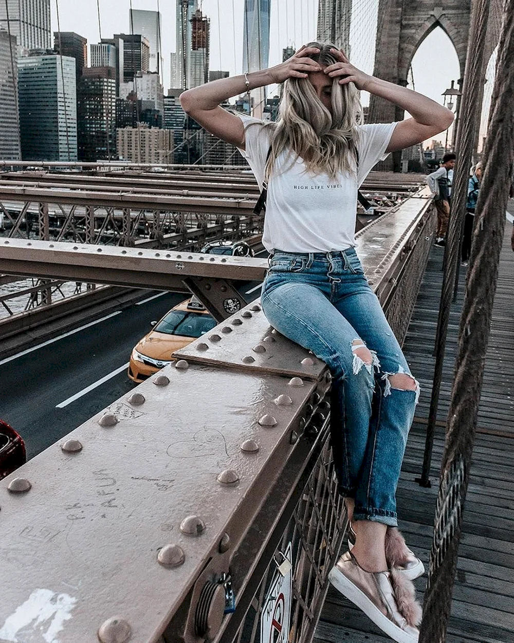 Girl sitting by Bridge