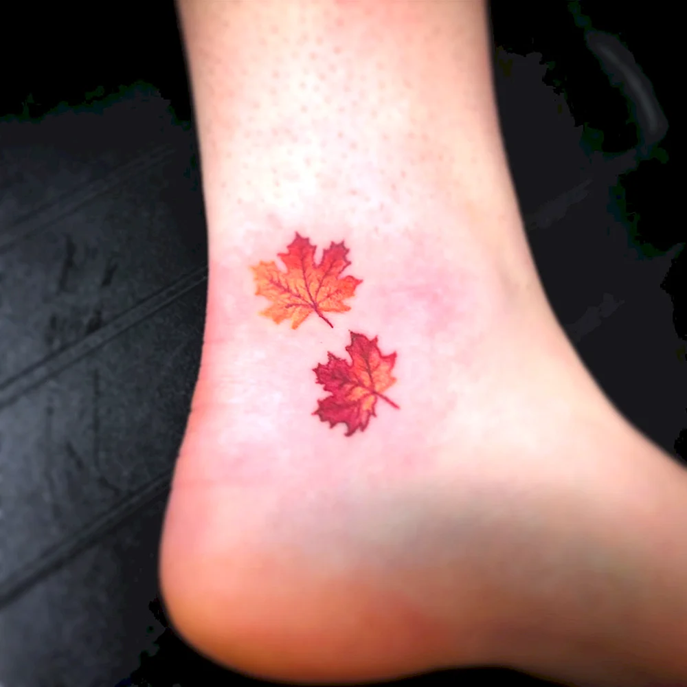 Maple Leaf Art Leg Tattoo