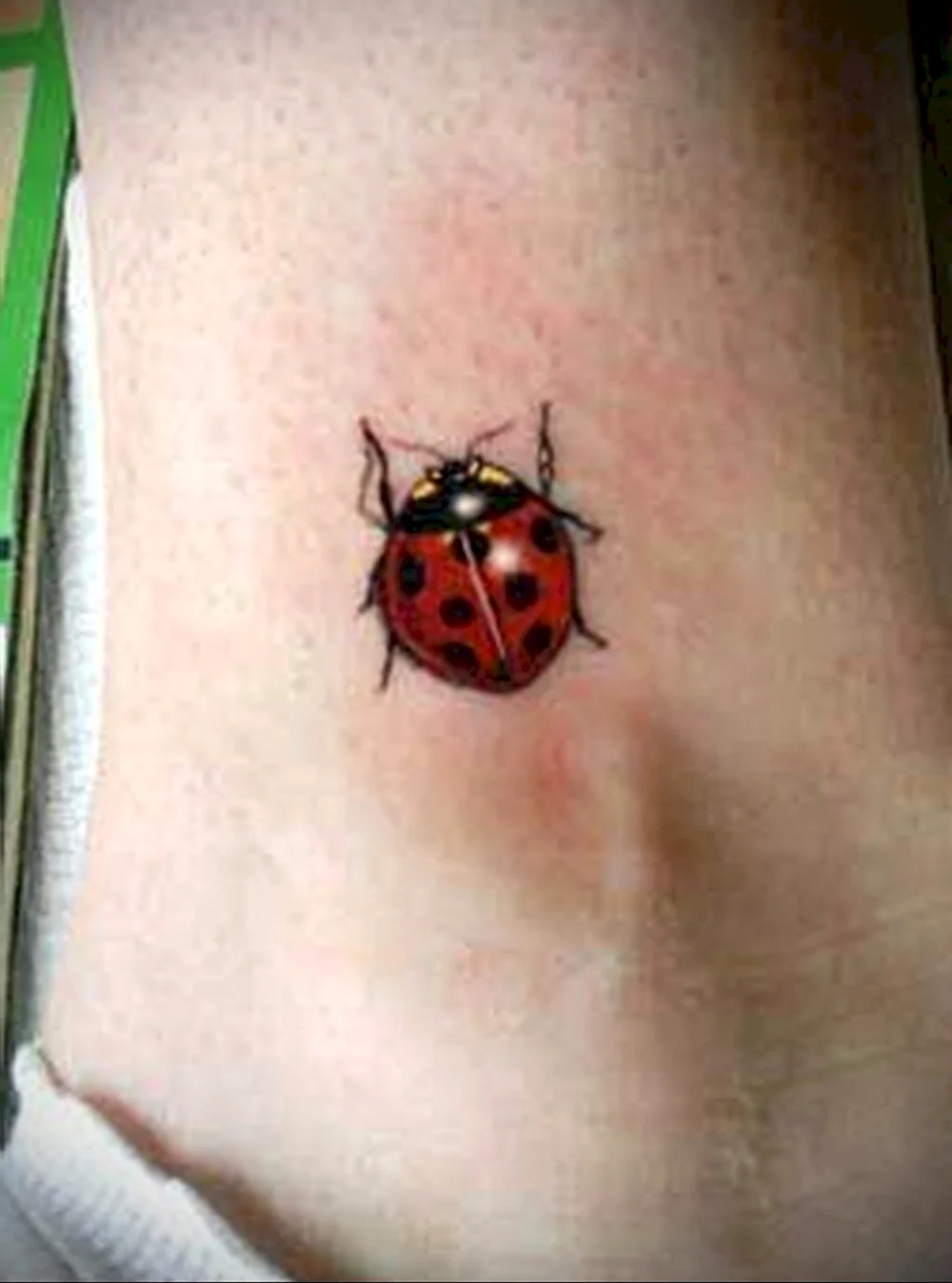 Pale blonde thong Ladybug Tattoo