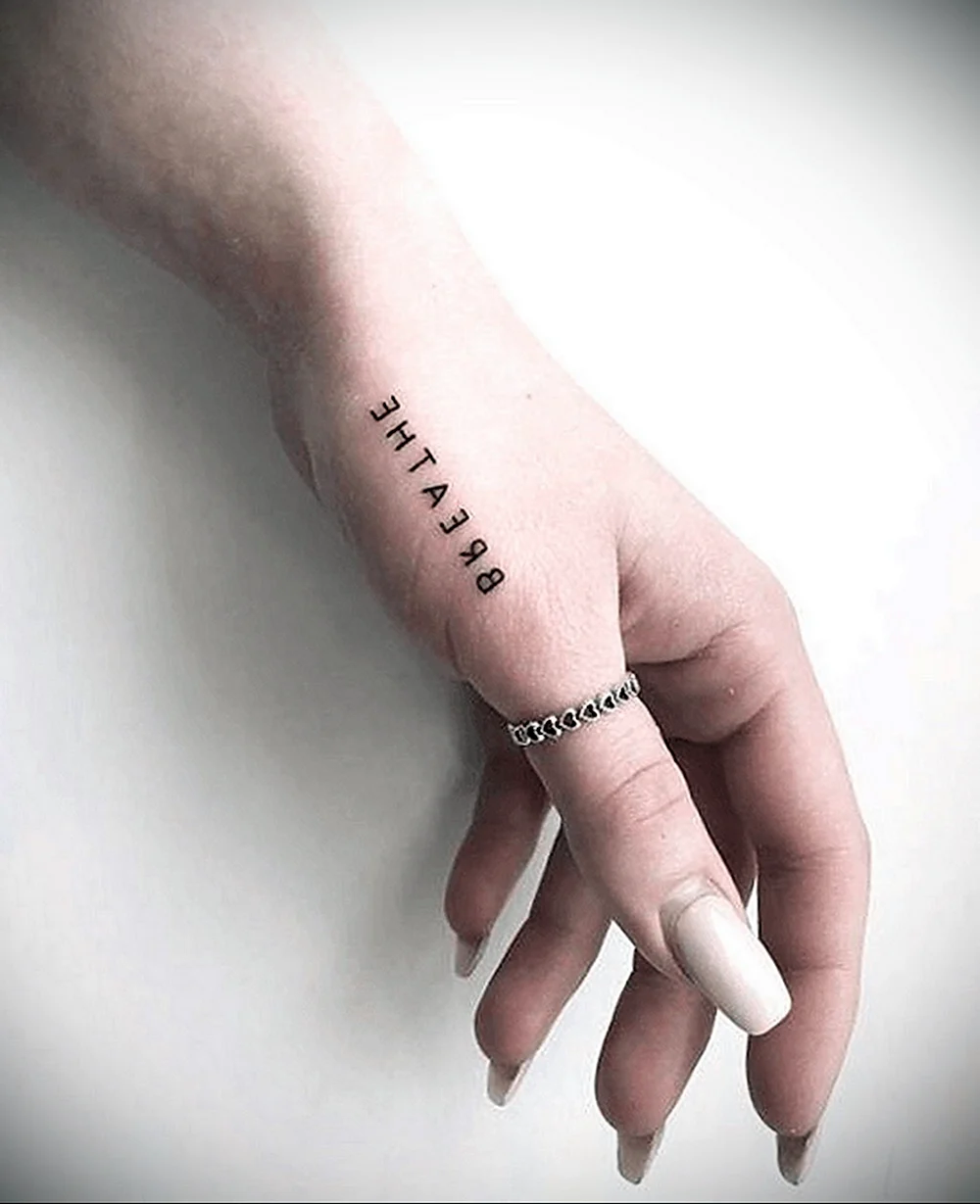 Small hand Tattoo