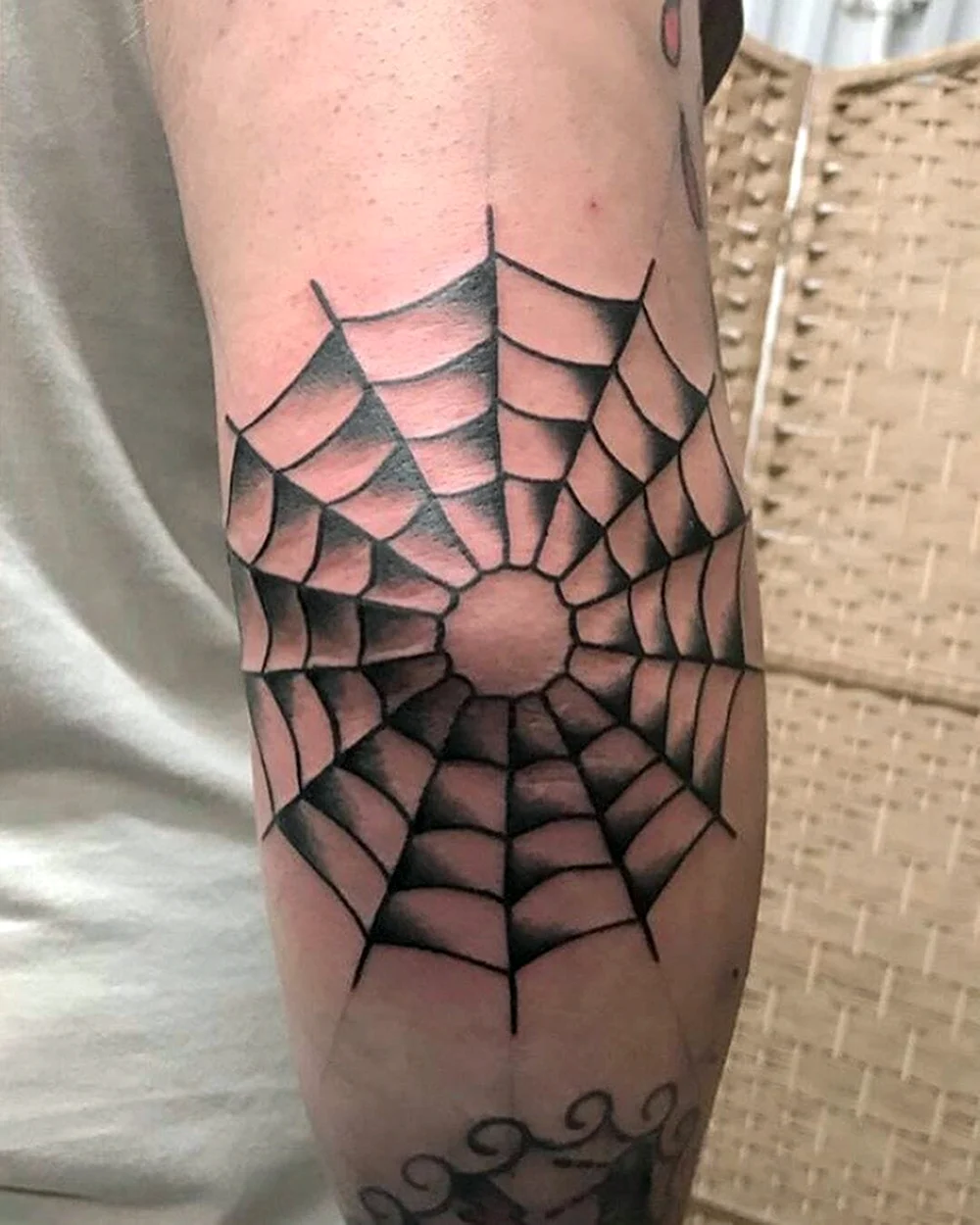 Spider web Elbow Tattoo meaning