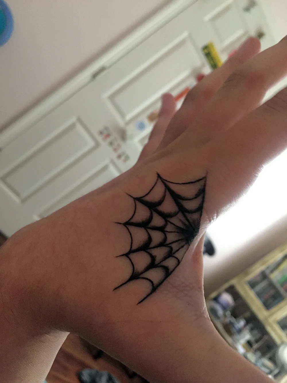 Spiderweb hand Tattoo